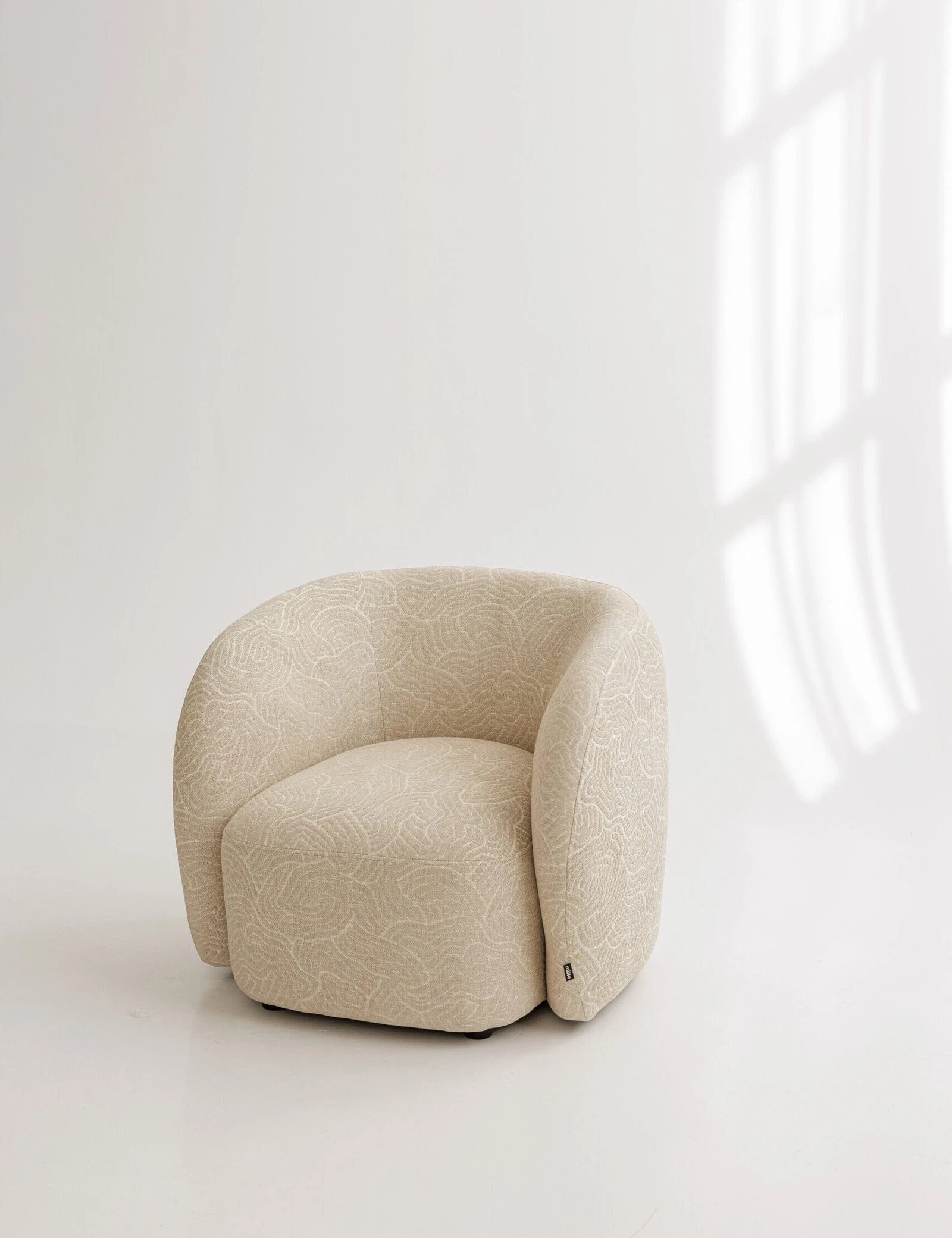 Argile 193003 Nuba armchair in a fine abstract line-pattern weave on natural ground