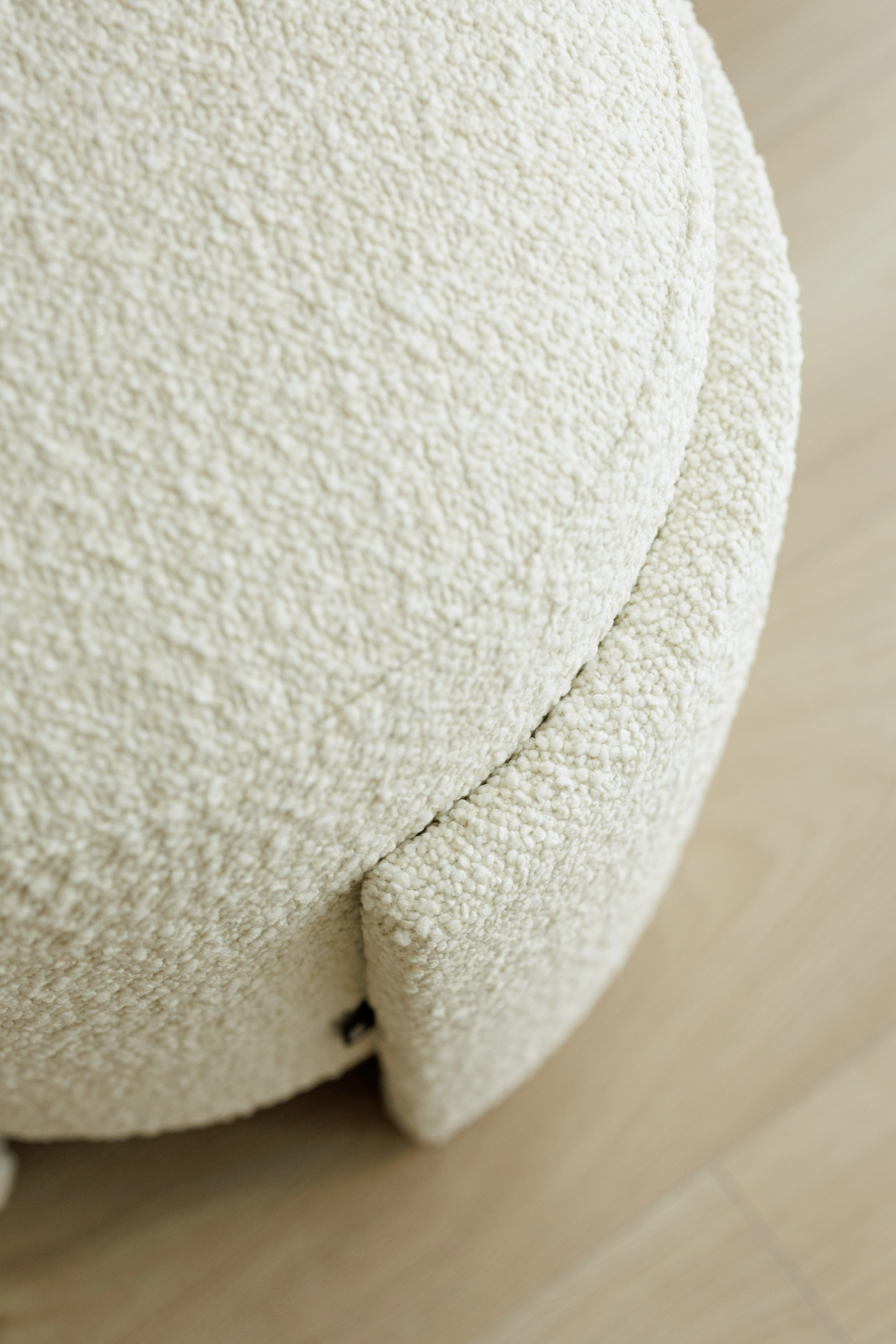 Close detail of the boucle texture on the Eden pouf