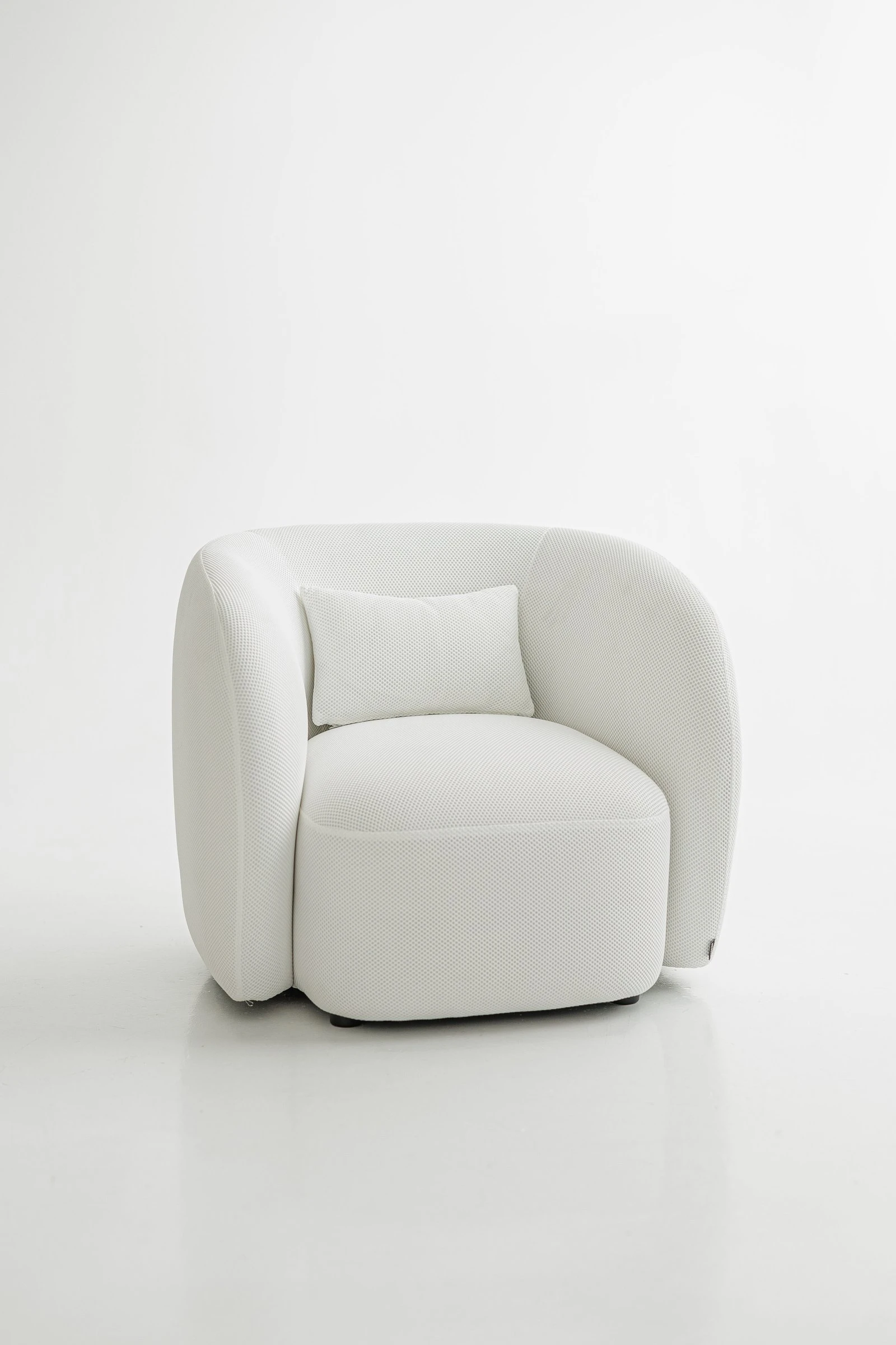 White Saturn 900 Nuba armchair in a textural honeycomb-like Belgian weave