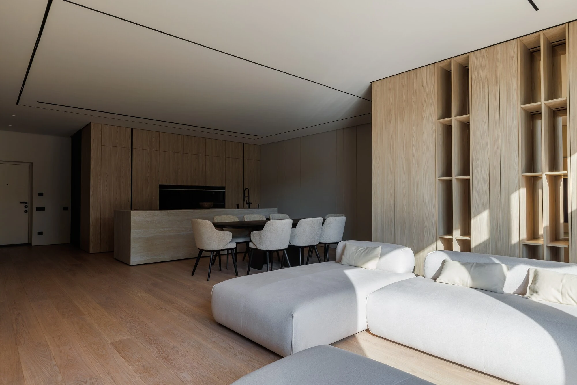 Overhead view of the cream Nissa in the oak-panelled apartment with the dining table beyond