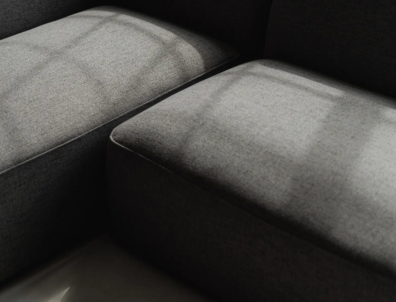 Close detail of two grey Kingston modules with light raking across the fabric seam