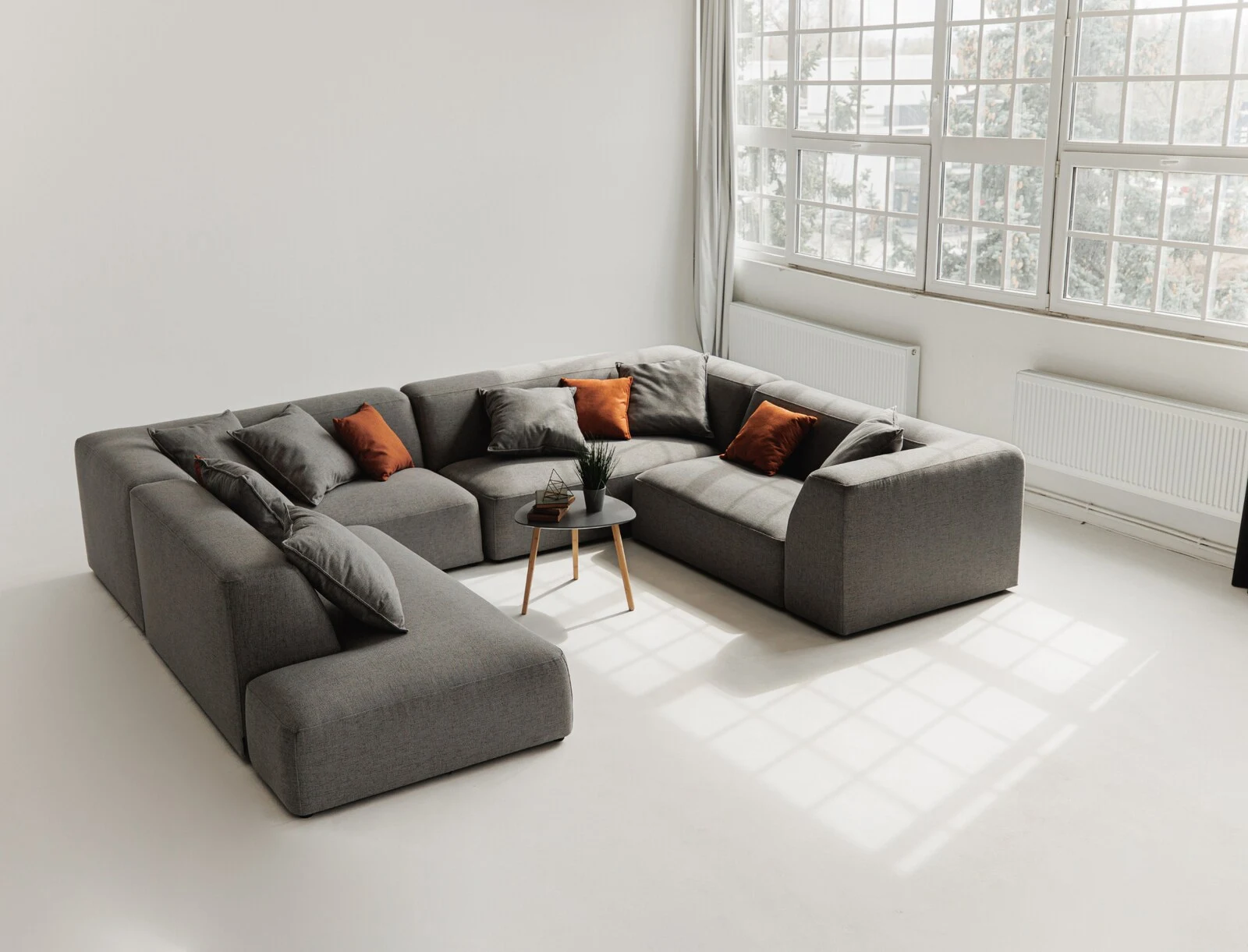 Grey Kingston U-shape configuration in a sunlit loft