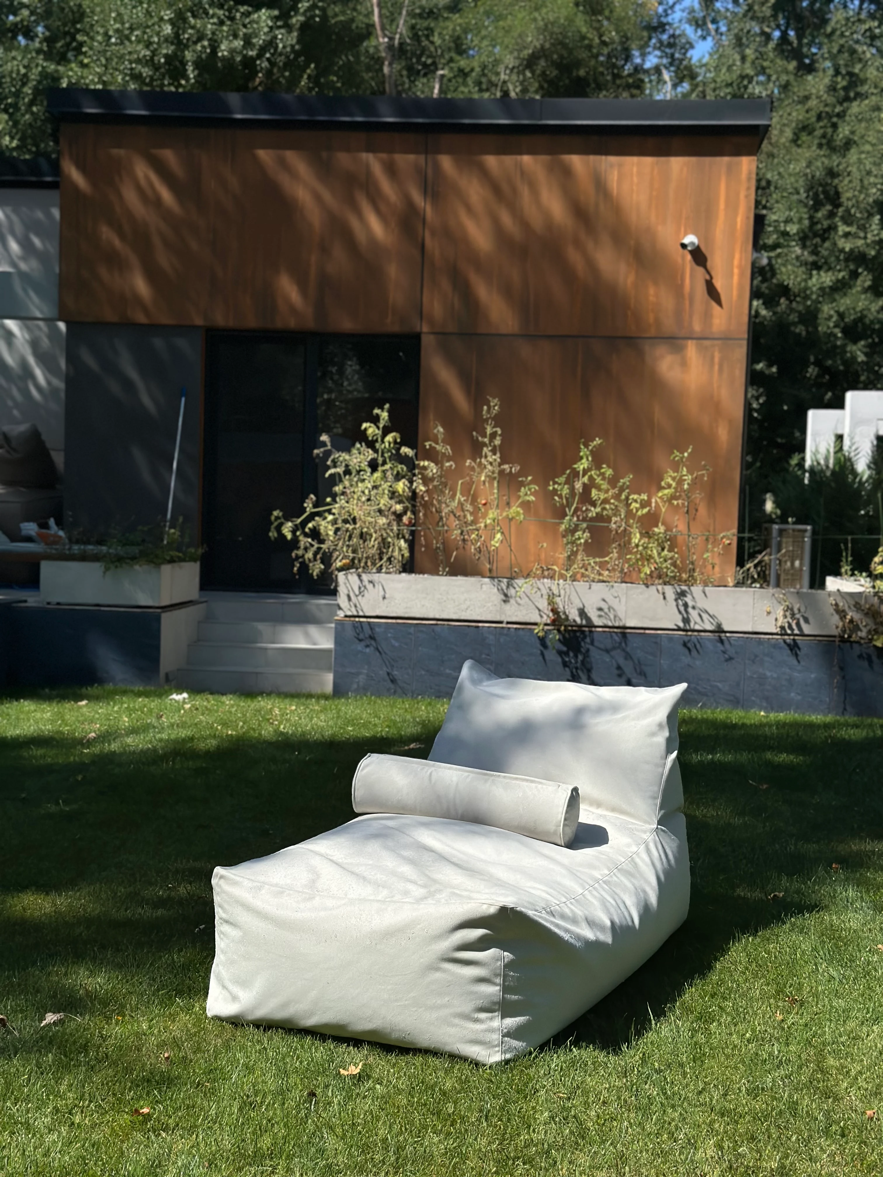Cream Marolla lounger on a villa lawn