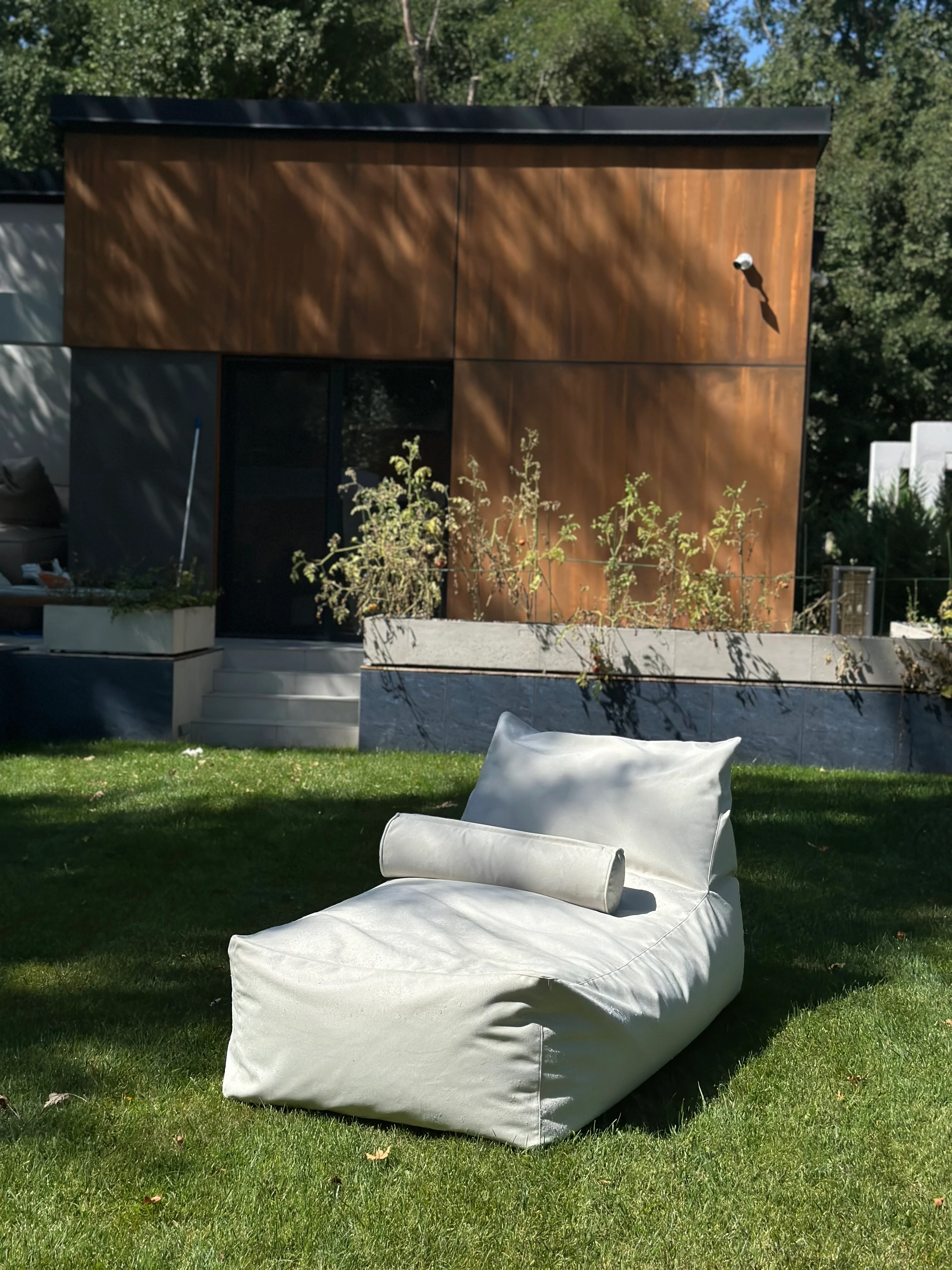 Cream Marolla lounger on a villa lawn