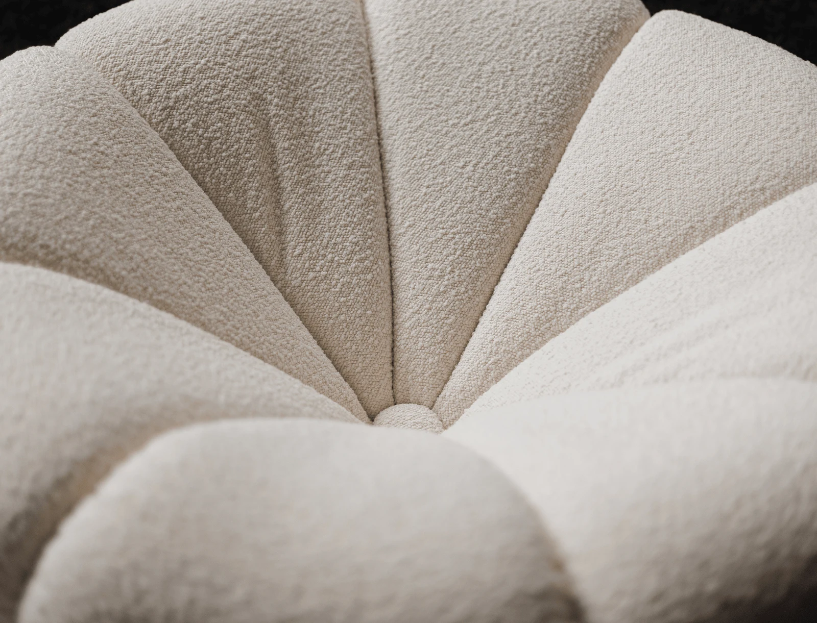 Top-down macro of the Flora back showing the scalloped petals radiating from a central seam at the seat