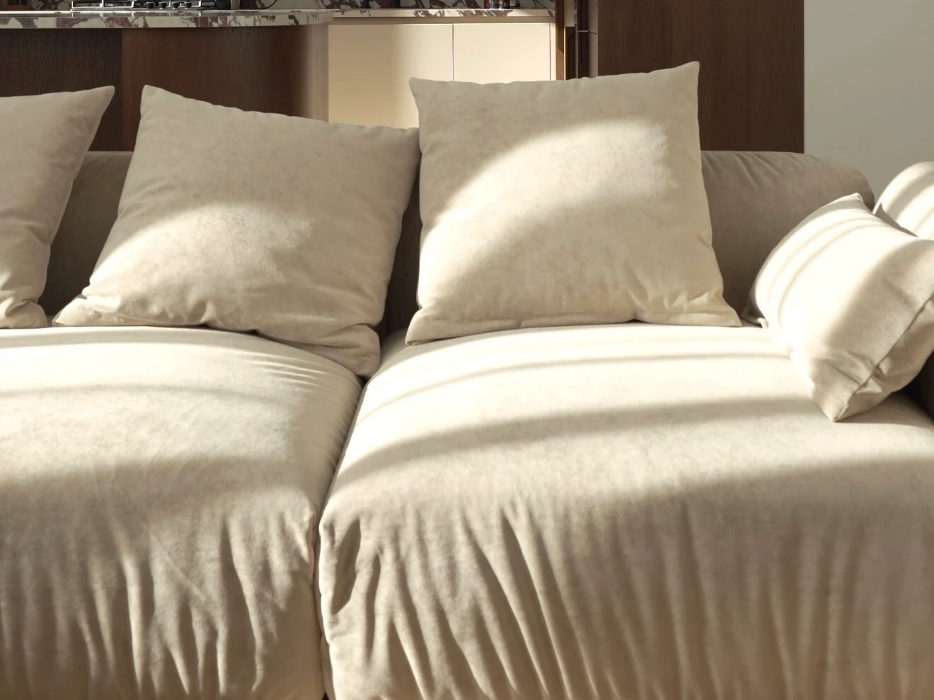 Close detail of cream velvet cushions in golden hour sunbeams