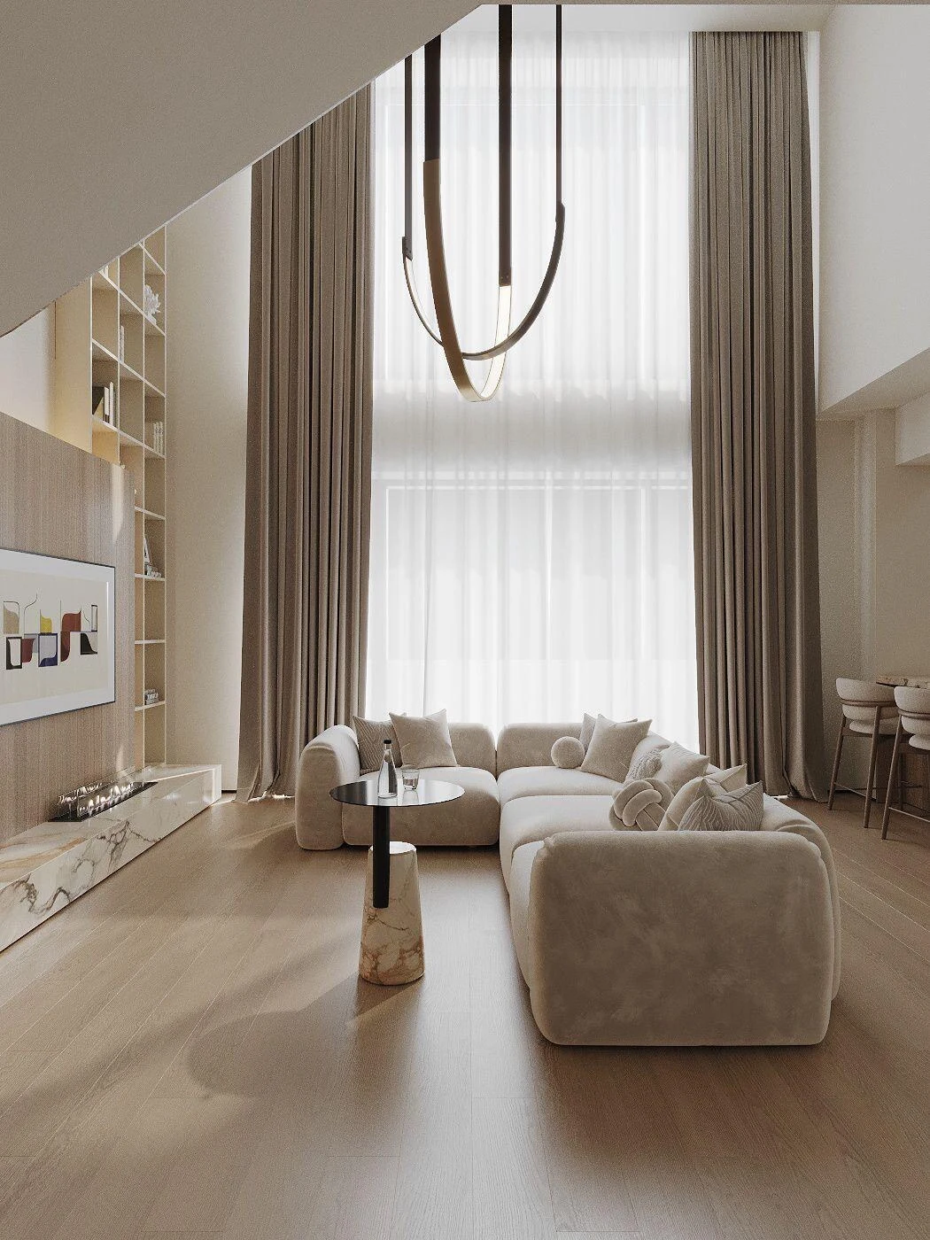 Cream Tesa in a double-height room with a brass chandelier and an abstract painting